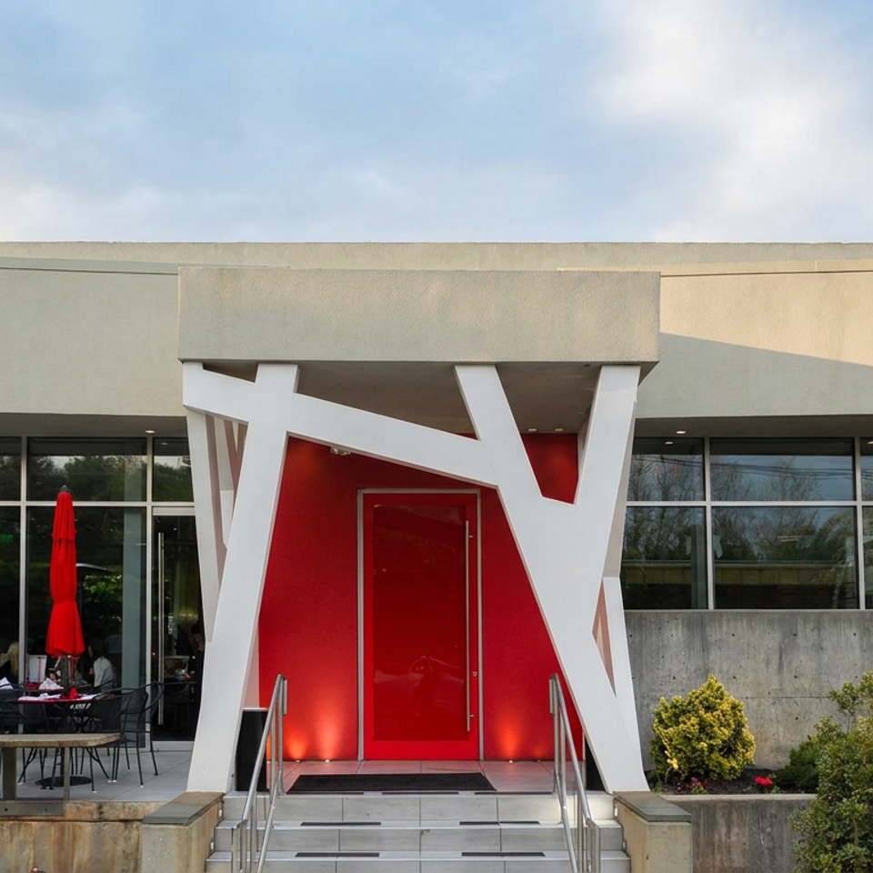 Modern Peking Pavilion restaurant exterior with red entrance, white geometric supports, patio seating, landscaping, and terracotta warrior statue.